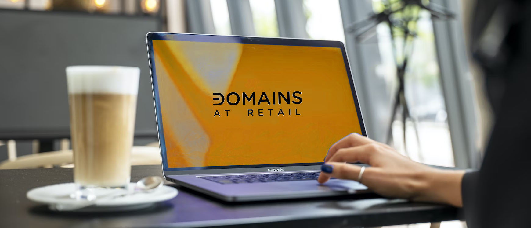 domains at retail on orange laptop screen